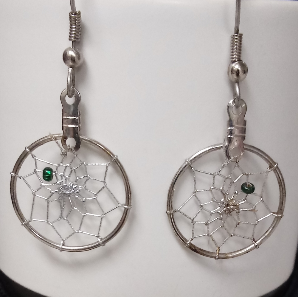 Silver earrings.